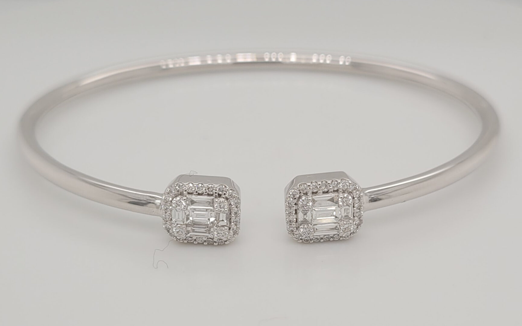 18kt White Gold (8.0 grams), 10 Baguettes (0.42tcw), 52 round (0.33tcw)