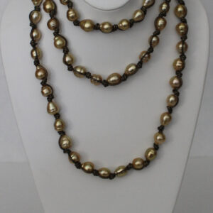 58" of 9.25-11.25mm Golden South Sea Pearls knotted on Leather with 18kt Yellow Gold Caps & Clasp